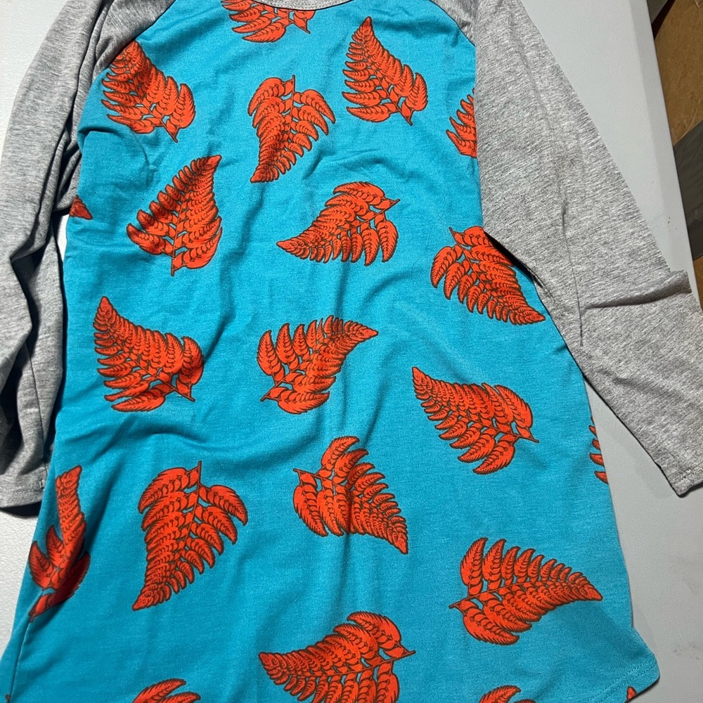 Vibrant Blue Shirt with Orange Leaf Design